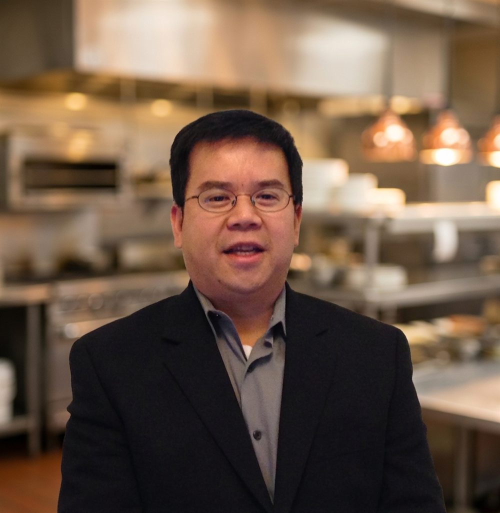 Vinh, former health inspector, in a commercial kitchen
